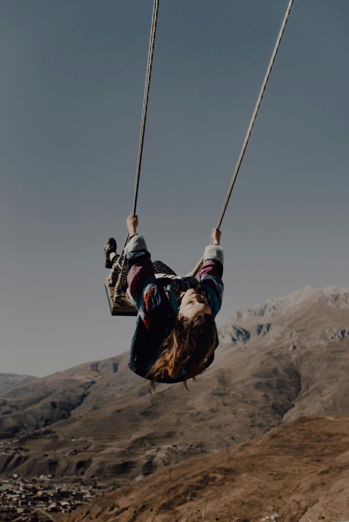 A girl swinging. 